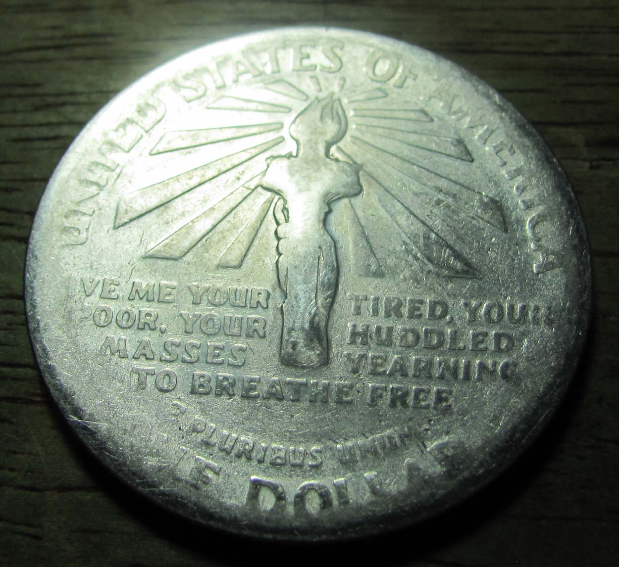Ellis-Island-Dollar-Pocket-Piece-Grade